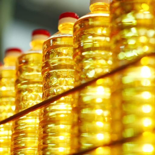 Sunflower oil. Line for the production and bottling of refined oil from sunflower seeds. Conveyor of food industry